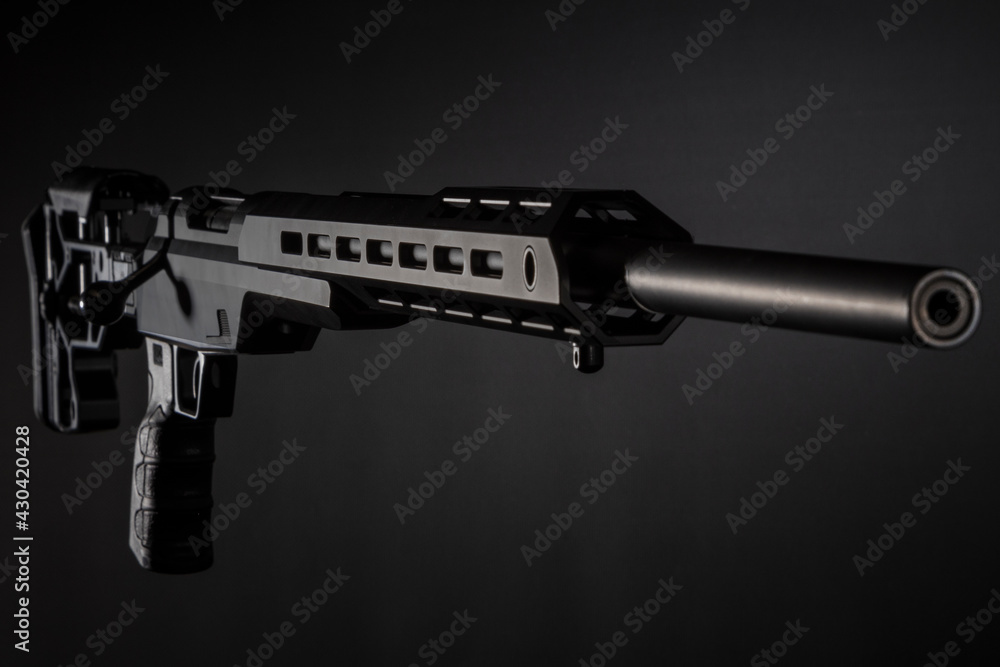 black sniper carbine on a dark background