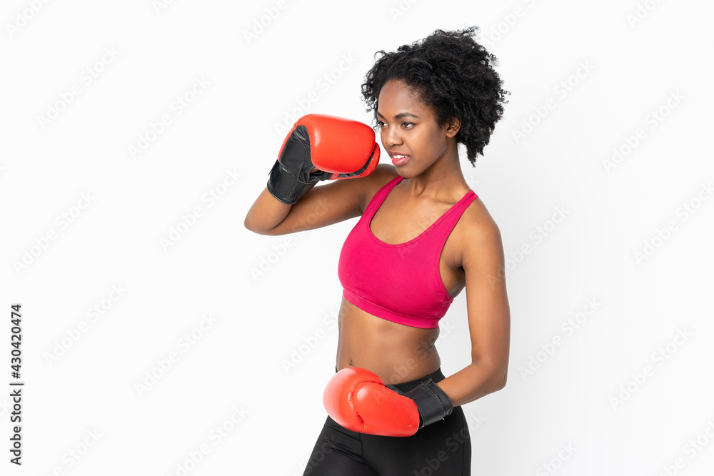 Young African American woman isolated on white background with boxing gloves