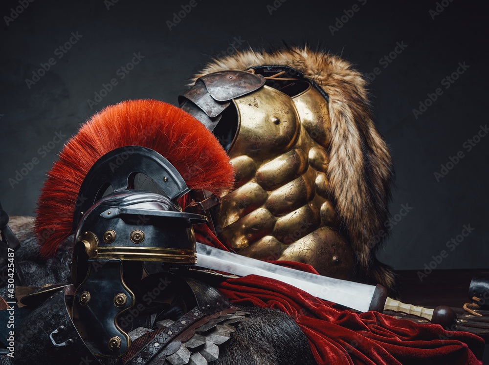 Close up shot of military roman armor and helmet - obrazy, fototapety, plakaty 