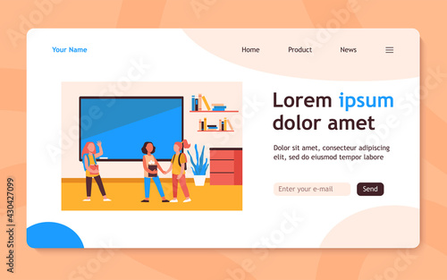 Schoolgirls meeting in classroom. Group of friends, classmates holding hands, waving hello flat vector illustration. Communication, friendship concept for banner, website design or landing web page