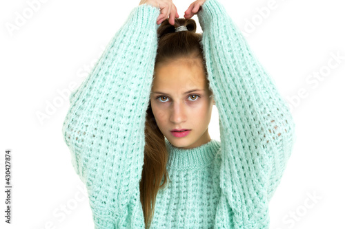Portrait of teen girl posing with arms raised