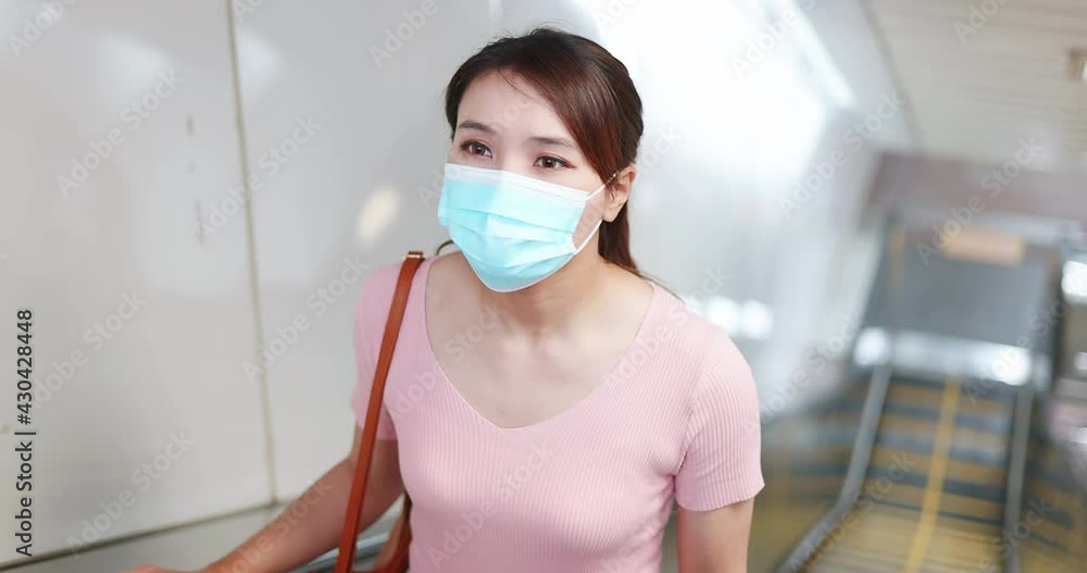woman with mask in station woman with mask in station
