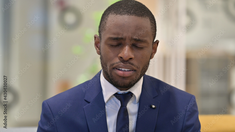 Portrait of Upset African Businessman Crying at Camera 