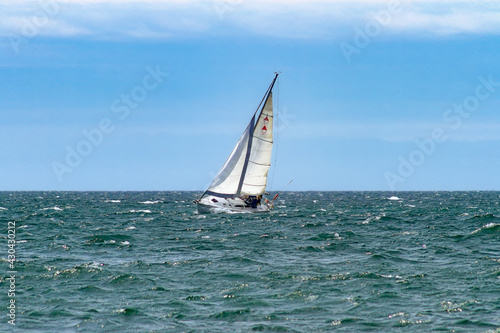 Sailboat on the Ontario lake in a windy day (Ontario, Canada).