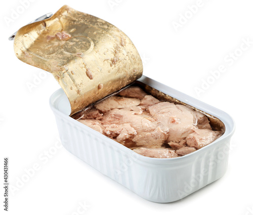 Canned cod liver in an open metal can on a white background. Isolated photo