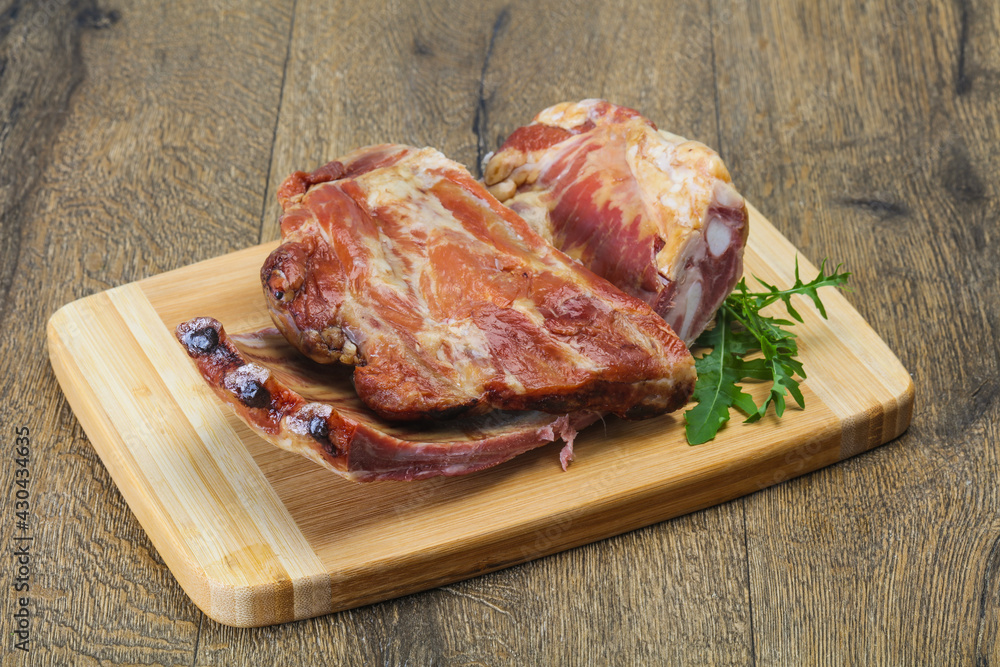 Smoked pork ribs over the wooden background