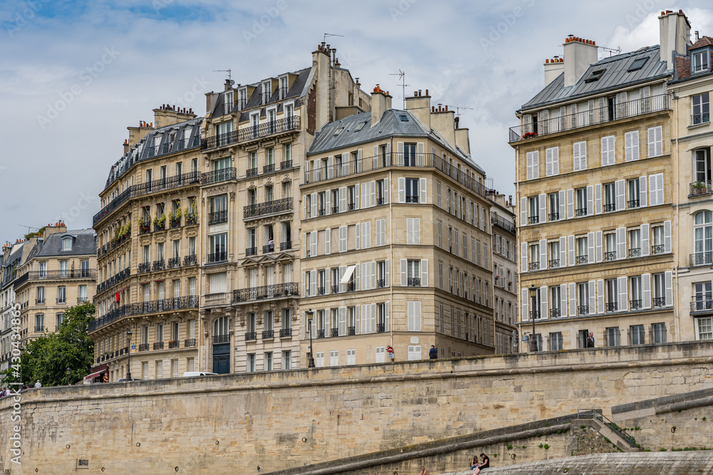 Haussmann apartment building along banks of the Seine river in Paris 