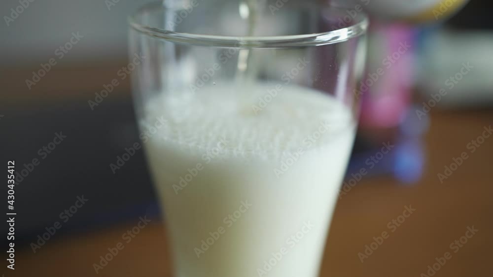 Pouring foamy beer into a glass Pouring foamy beer into a glass