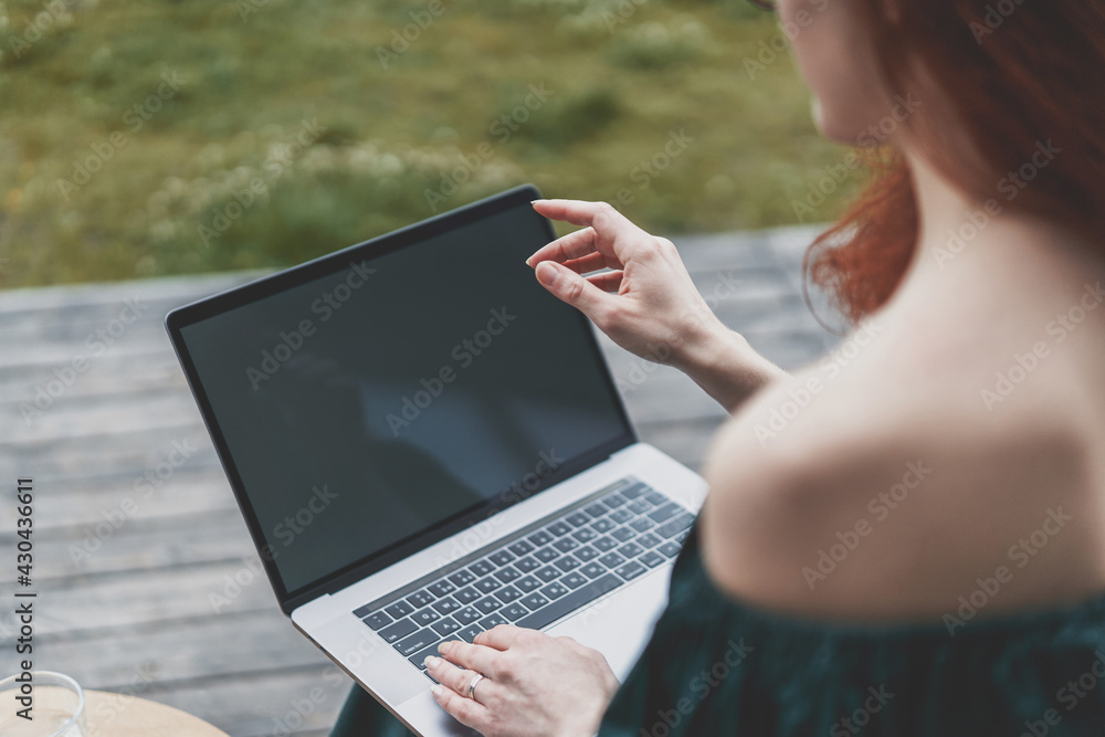Closeup view of young woman have video meeting with team on a laptop from home Closeup view of young woman have video meeting with team on a laptop from home
