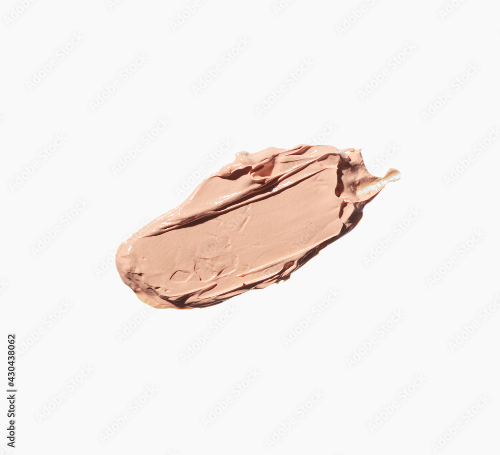 A smear of makeup foundation isolated on a white background. Swatch, texture A smear of makeup foundation isolated on a white background. Swatch, texture