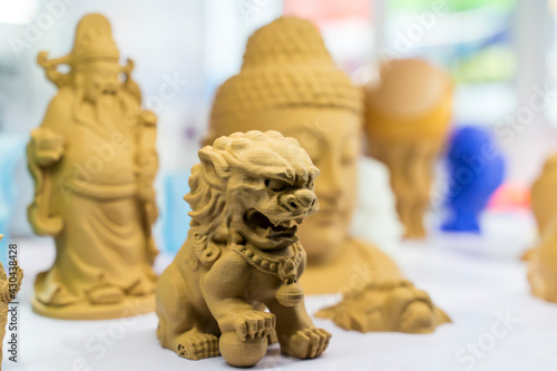 3D printer printing chinese traditional lion figure close-up.