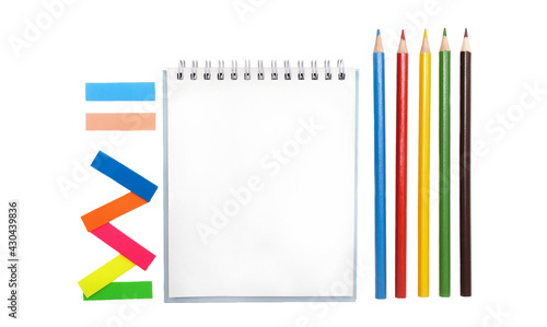 Stationery: notepad, colored pencils, multi-colored paper bookmarks