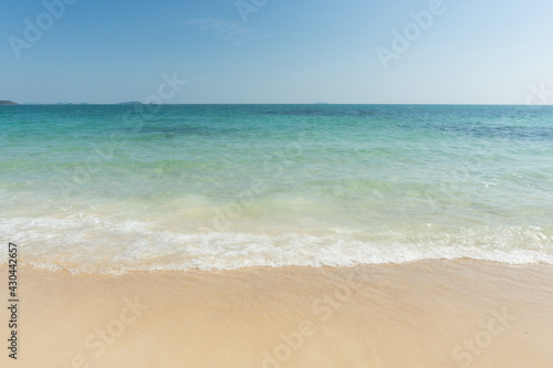 Beach and waves tropical sea with blue sky on sunny day background. copy space..