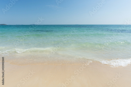 Beach and waves tropical sea with blue sky on sunny day background. copy space..