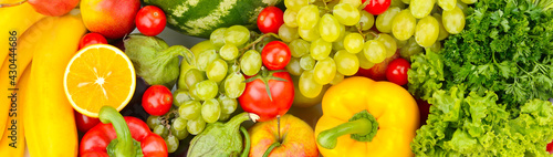 Panoramic shot of vegetables and fruits.
