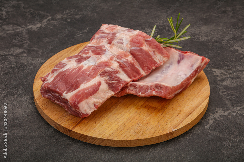 Raw pork ribs served rosemary Raw pork ribs served rosemary