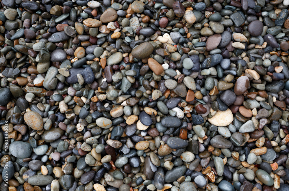 wet gray pebbles on the seashore. great background for design wet gray pebbles on the seashore. great background for design