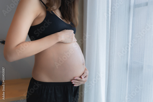 Portrait of asian pregnant woman in the bedroom Free Download Portrait of asian pregnant woman in the bedroom - GFXLoad