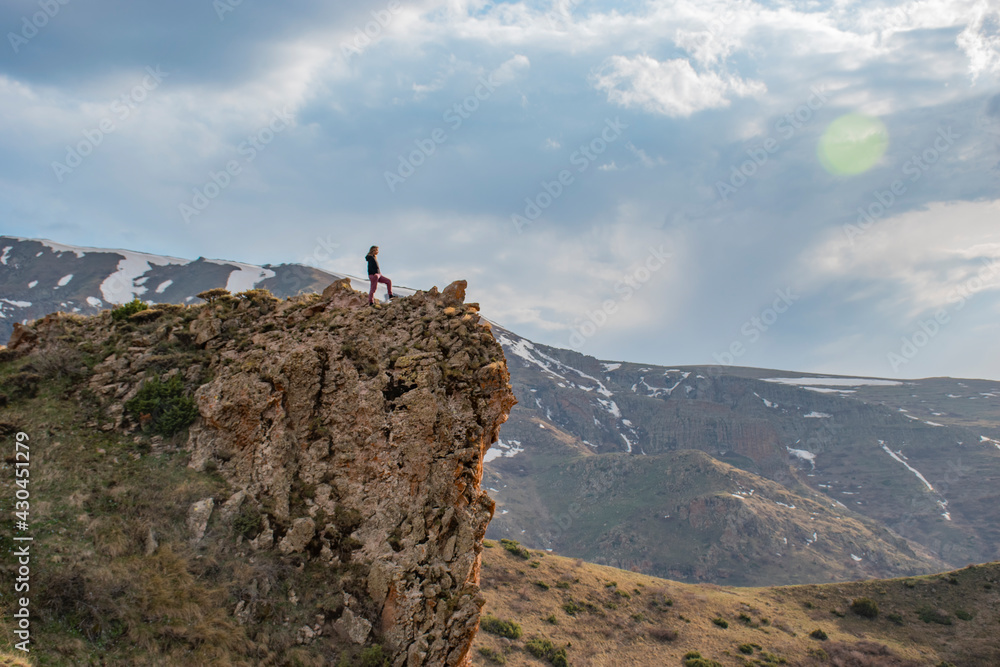 man on top of mountain