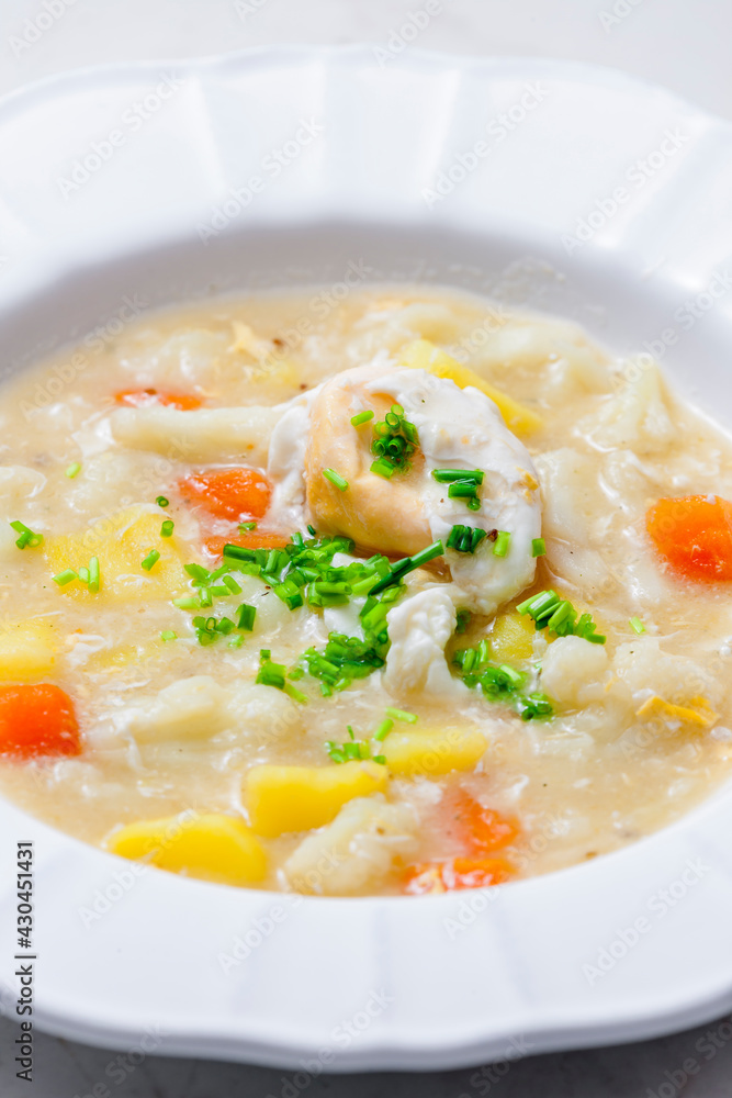 cauliflower soup with carrot, potatoes and poache egg