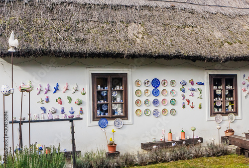 Obraz na płótnie Old farmhouse with thatched roof. Cups and plates are sold, Tihany, Veszprem county, Central Transdanubia, Hungary, w salonie