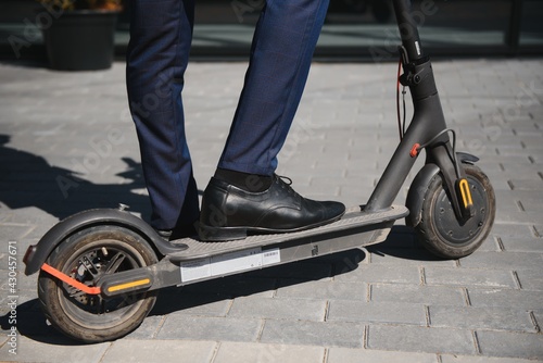 Young African businessman Riding An Electric Scooter