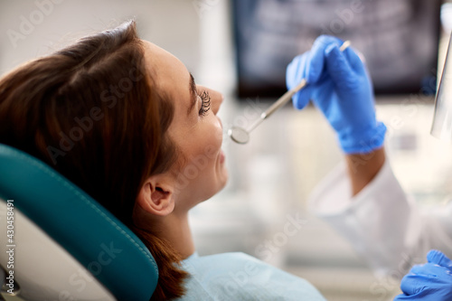 Close-up of woman having her teeth checked at dentist s office.