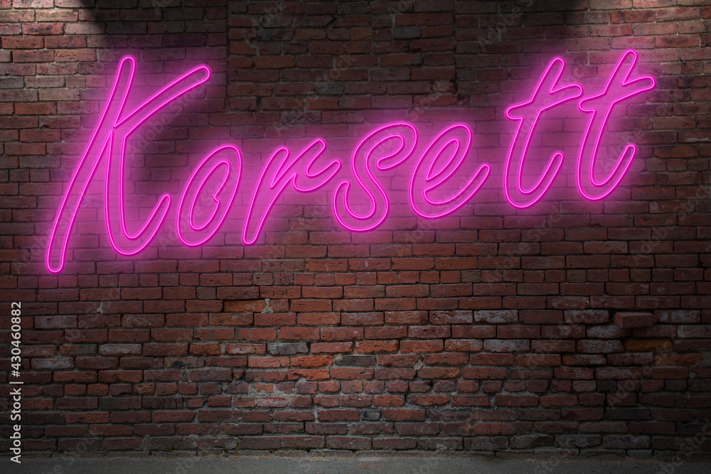 Obraz premium Neon corset (in german Korsett) lettering on Brick Wall at night