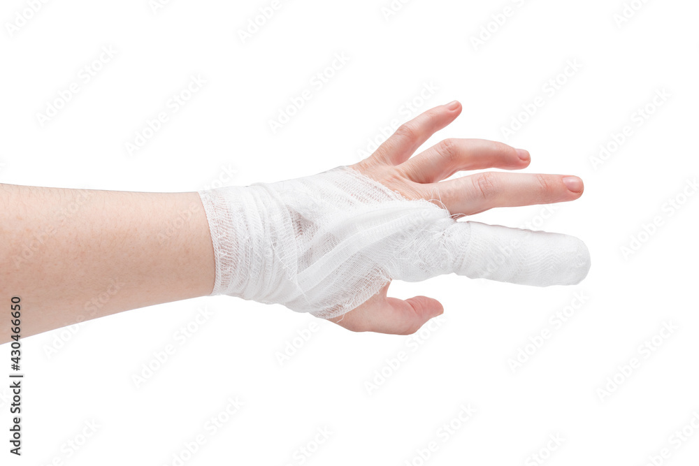 White-skinned hand with bandaged index finger and wrist, backside, isolated on white background. White-skinned hand with bandaged index finger and wrist, backside, isolated on white background.
