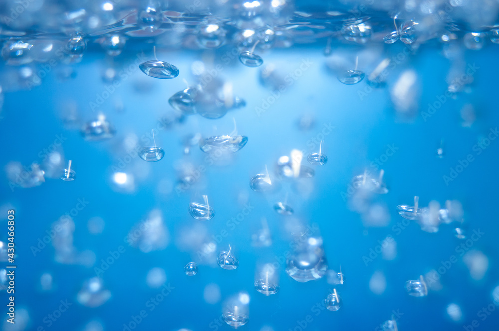 air bubbles in the water isolated on blue background air bubbles in the water isolated on blue background