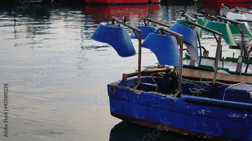 blue fishing boat in the harbor