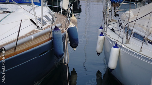 bumper buoys from sailboats at harbor