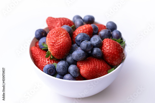 fruit in a bowl on a light background