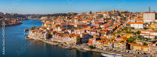 Panoramic view of Old city of Porto (Oporto) and Ribeira over Douro river, Portugal. Concept of world travel, sightseeing and tourism.