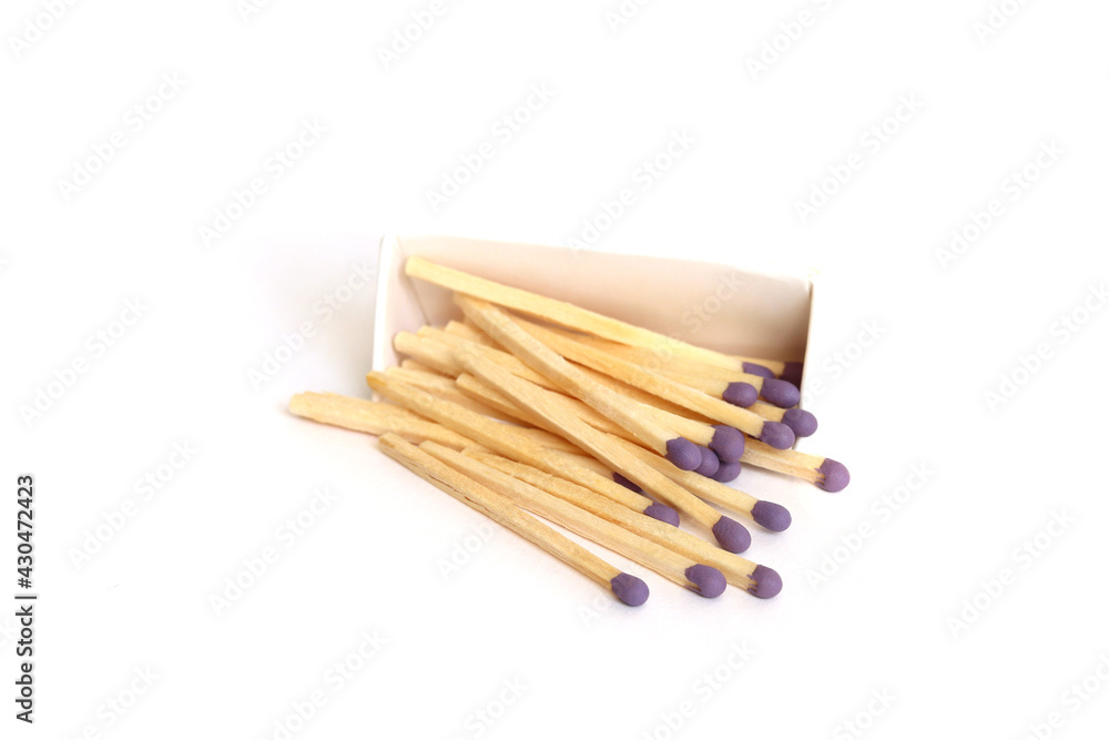 Purple matches in a box on a white background isolated