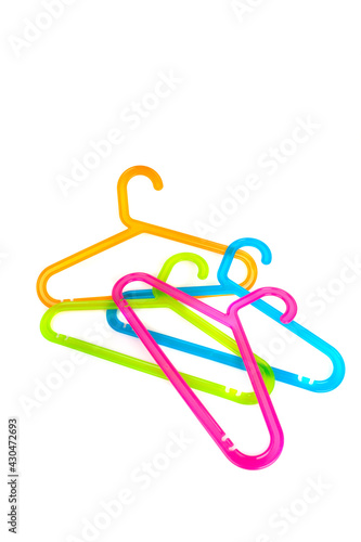 Colored plastic hangers isolated on white background. Storage and sales concept