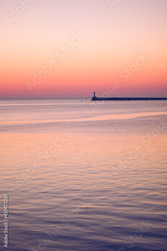 evening sunset on the Black Sea coast on the seaside boulevard of the hero city.