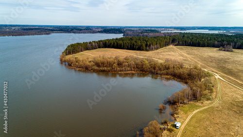 Ozerninskoe reservoir. artificial reservoir in Ruzsky urban district of Moscow region of Russia. Lake or river bank. Aerial view. Fields for crops in early spring. photo