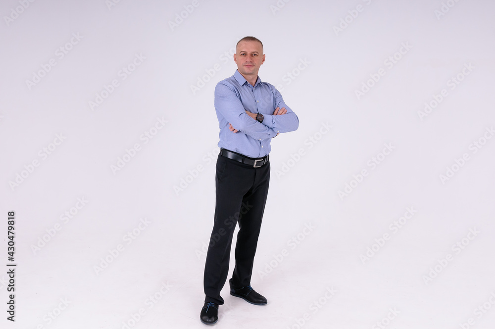 Man in blue shirt and black trousers on white background Man in blue shirt and black trousers on white background