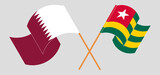 Crossed and waving flags of Qatar and Togo