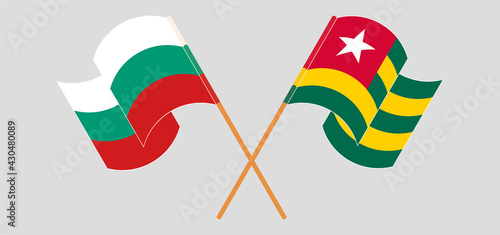 Crossed and waving flags of Bulgaria and Togo