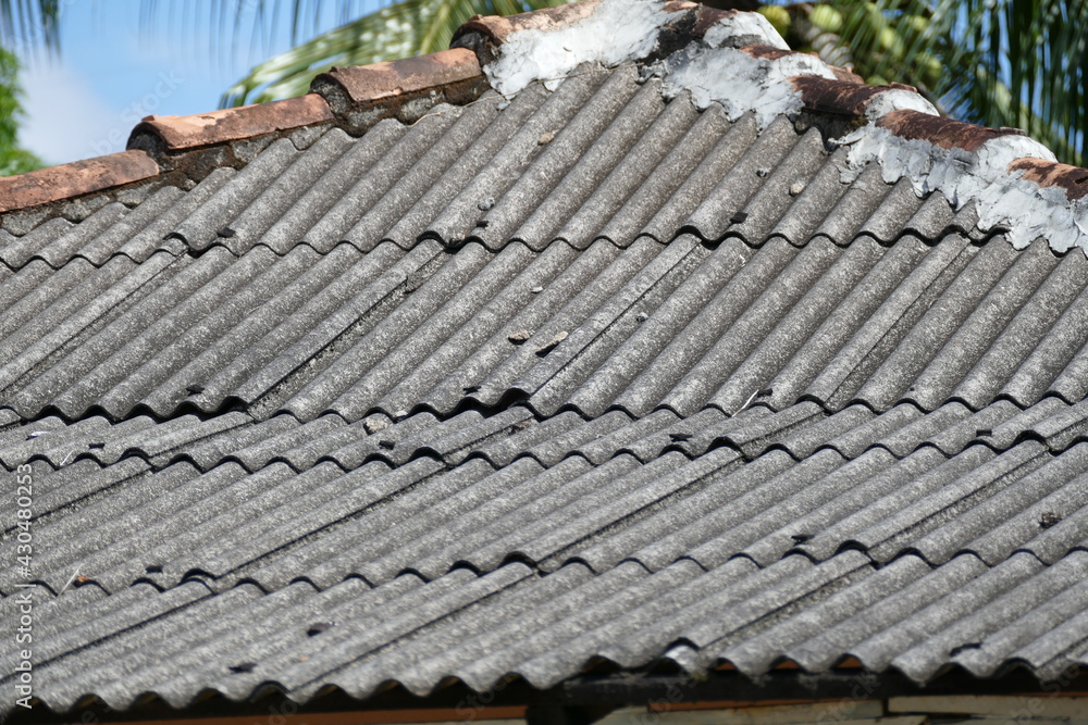 Roof covering with dangerous asbestos, eternit as building material. In many countries this material is due to cancer risk from microfibers banned. Manaus, Amazon state, Brazil.