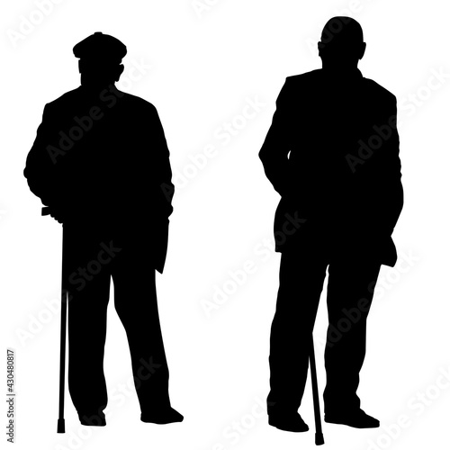 Two elderly people silhouette with canes