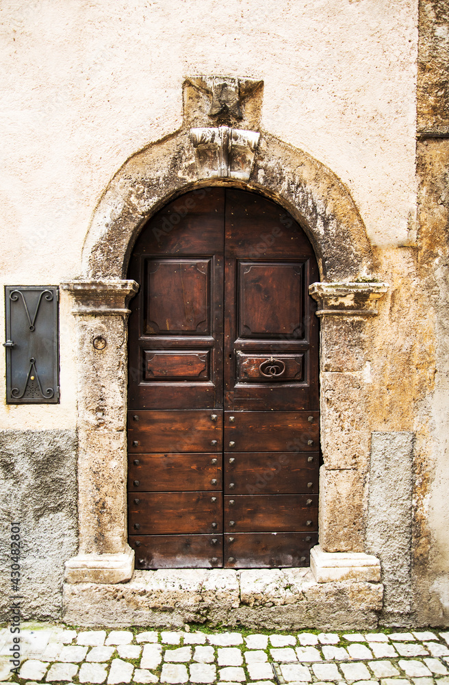 Old wooden italian door in the small village of Scanno