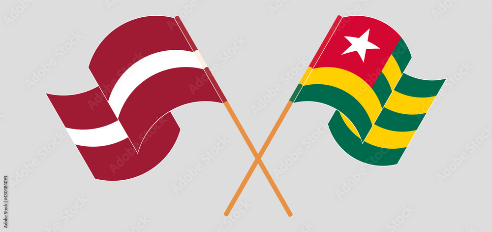 Crossed and waving flags of Latvia and Togo Crossed and waving flags of Latvia and Togo