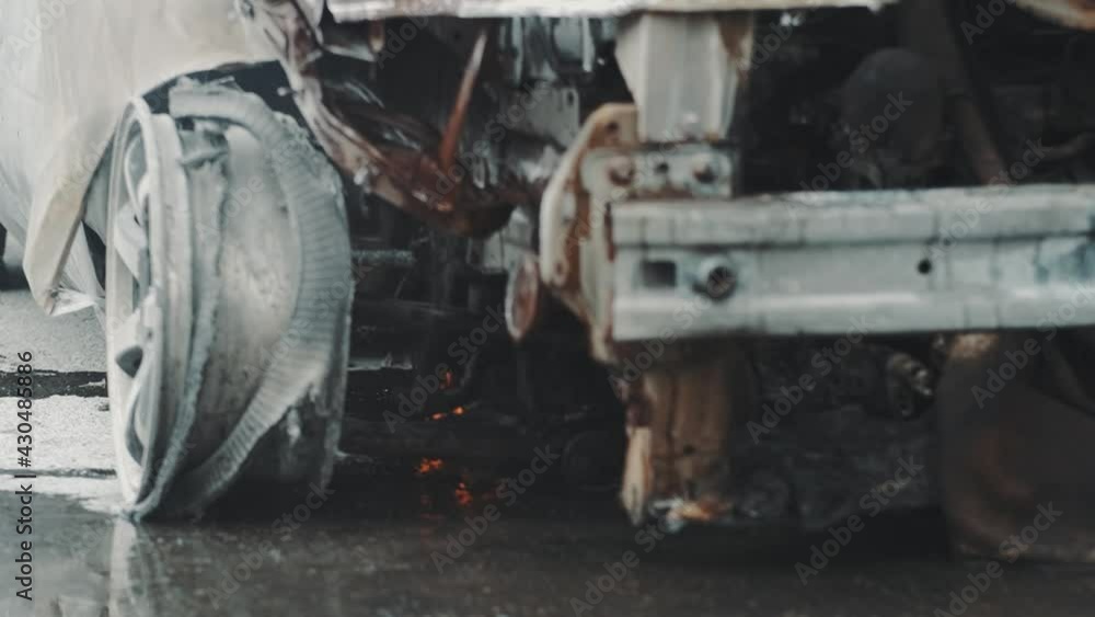 Car burns after a road accident. Accident, the car caught fire on the road. Slow motion Car burns after a road accident. Accident, the car caught fire on the road. Slow motion