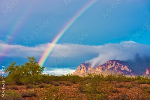 rainbow in front of the mountains