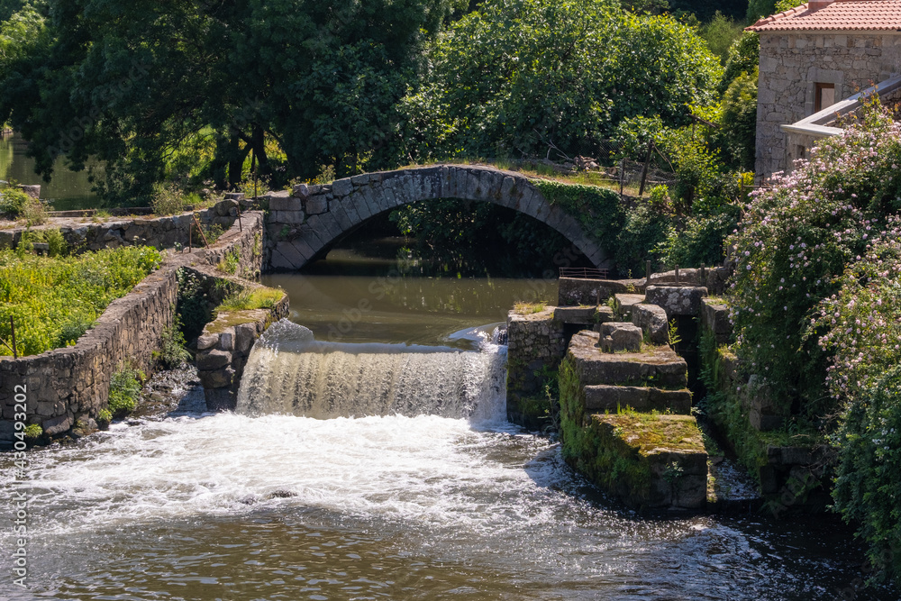 Historic medieval stone bridge over Este river in Touguinho, Portugal Historic medieval stone bridge over Este river in Touguinho, Portugal