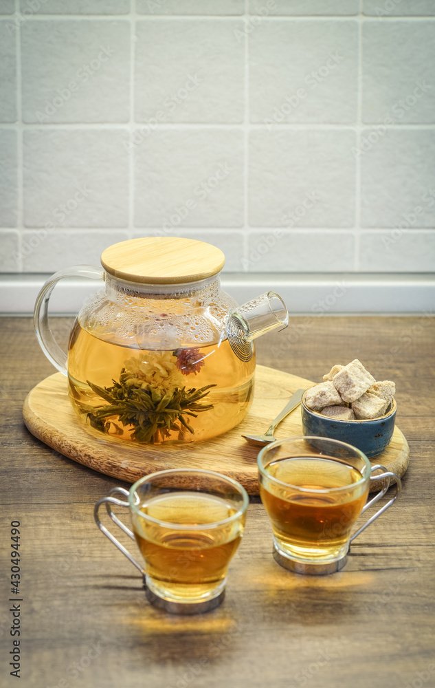 Blooming flowering tea in glass teapot Blooming flowering tea in glass teapot