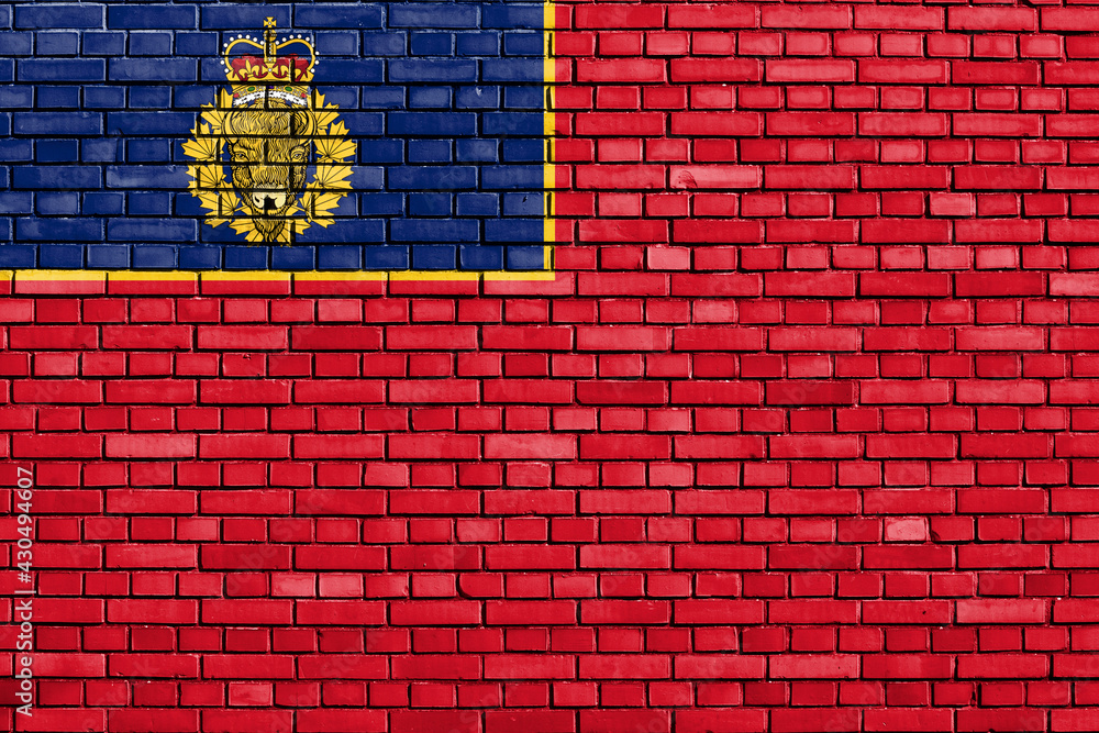 flag of Royal Canadian Mounted Police painted on brick wall